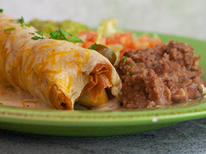 Queso-Smothered Beef Chimichangas - The Chunky Chef